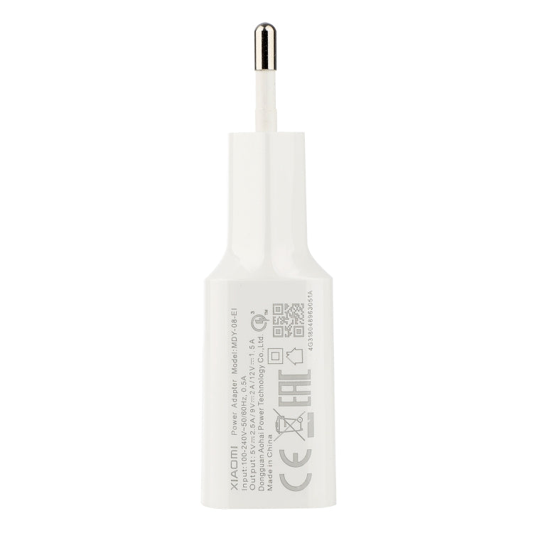 White wall charger with USB-C plug and printed compliance label on back
