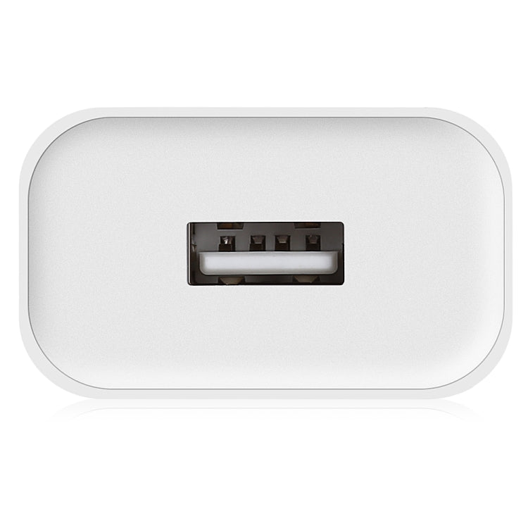 White compact wall charger with recessed USB charging port