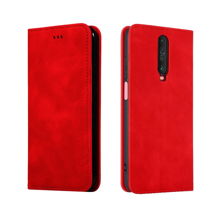 Red leather flip phone case with button cutouts and rear camera opening