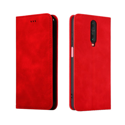 Red leather flip phone case with button cutouts and rear camera opening