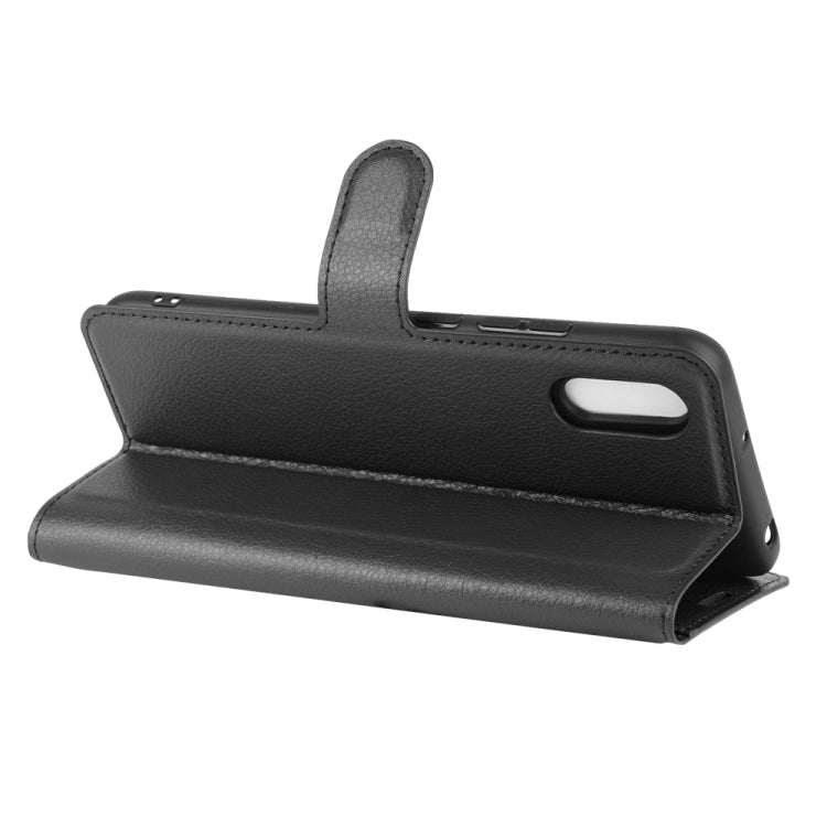 Black litchi-texture flip wallet case in stand mode for viewing with card slots