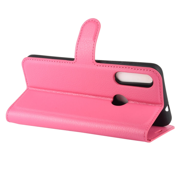 Pink flip protective phone case with belt-strap style wrist loop and kickstand