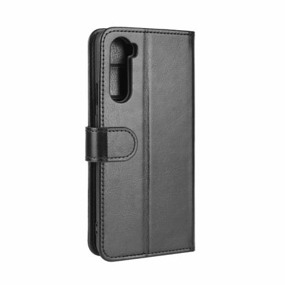 Black textured folio phone case with camera cutout and fold-over side strap