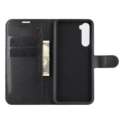 Black flip phone case with card holder flap and cutouts for camera and speaker.