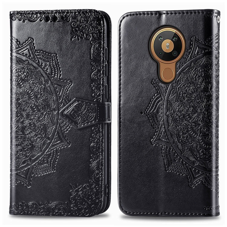 Black embossed leather-style flip phone case with mandala design and card slot flap