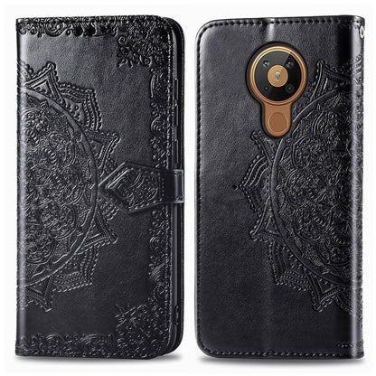 Black embossed leather-style flip phone case with mandala design and card slot flap