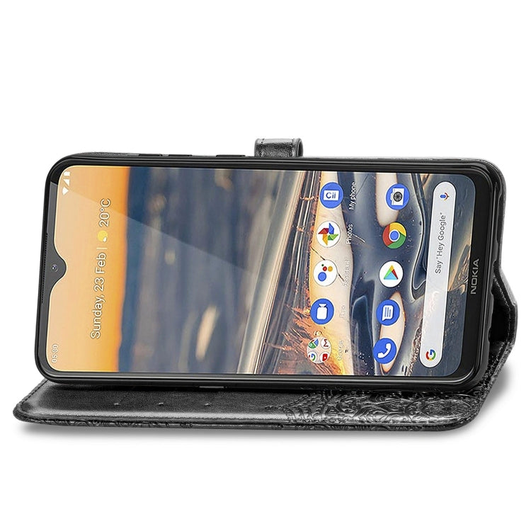 Black embossed leather-style flip wallet with folio cover and phone screen visible