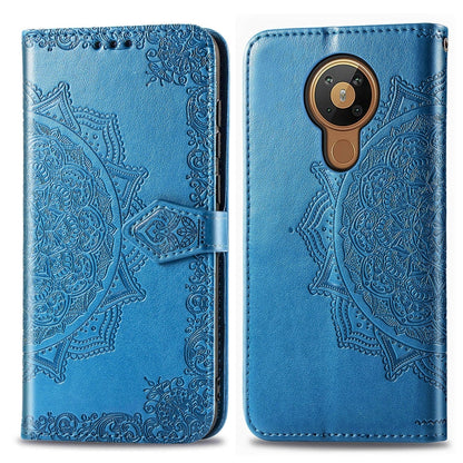 Blue mandala-embossed flip leather phone case with card slot and magnetic closure