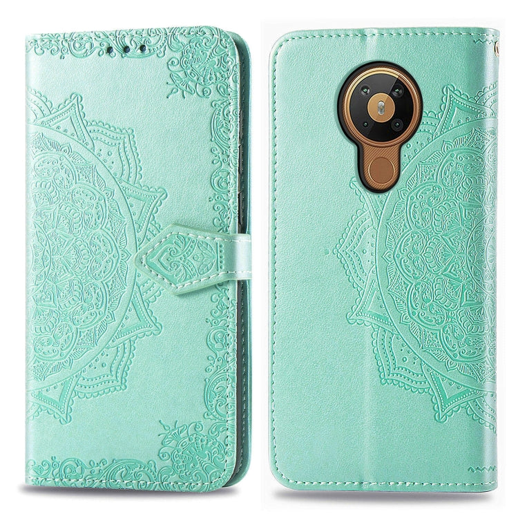 Mint green mandala-embossed flip leather phone case with card slot and magnetic closure