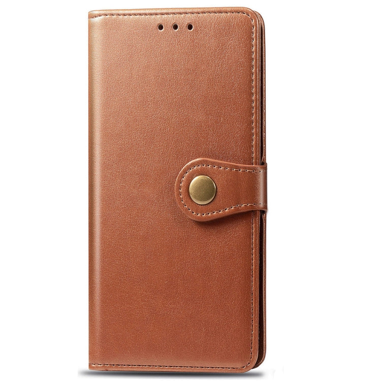 Brown leather flip phone case with front magnetic snap and stitched button detail