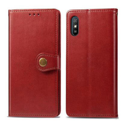 Red leather phone wallet case with button buckle strap closure and card slot; dual phone view.