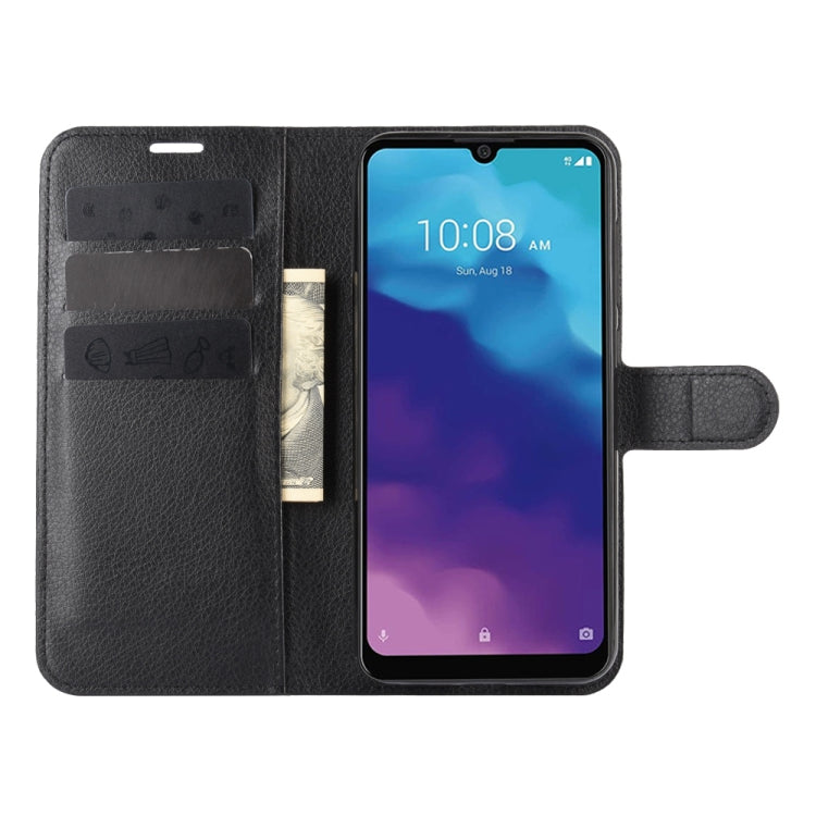 Black leather-style wallet flip phone case open with phone screen visible.