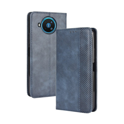 Blue leather flip phone case with camera cutout and textured side panel.