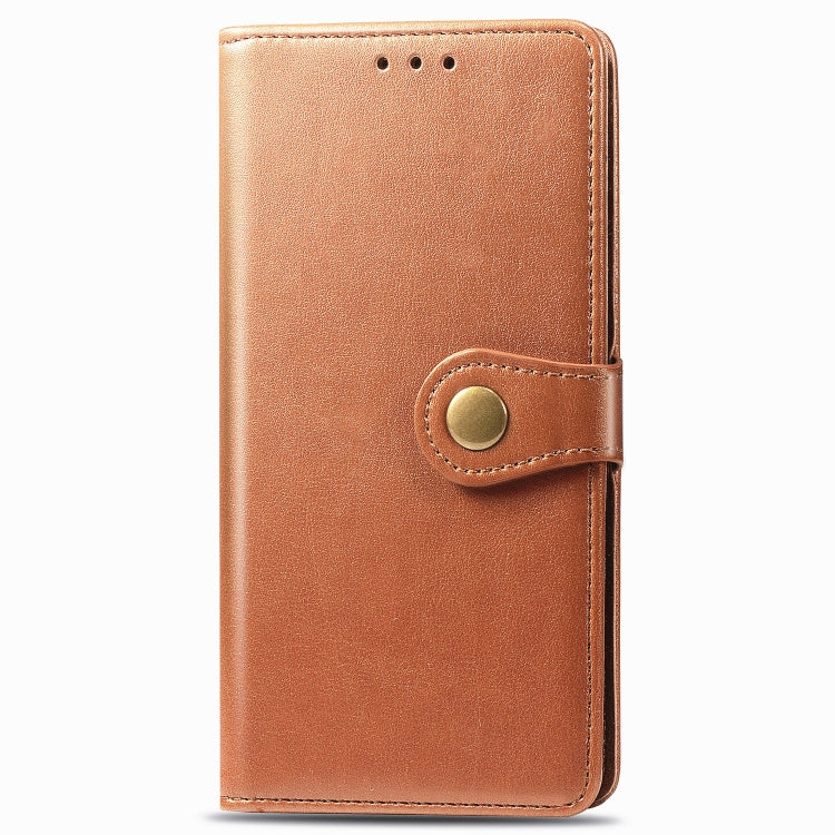 Brown leather flip phone case with round magnetic snap and card cutouts