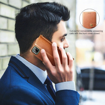 Brown leather flip phone case on a phone, with camera cutout and buckle