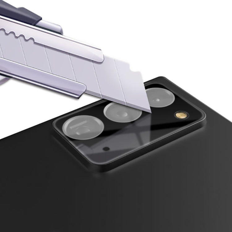 camera lens tempered glass film aligning over three lenses on phone back