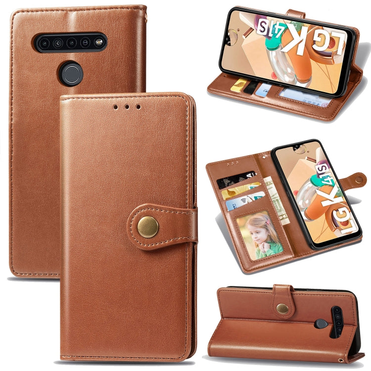 Brown leather flip phone wallet case with buckle, photo window, card slots, and stand