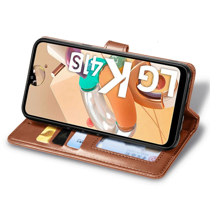 Brown leather flip phone wallet case folded as a stand with photo card compartments