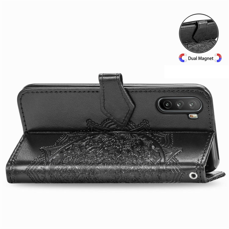 Black embossed mandala leather wallet case with camera cutout and fold-over flap