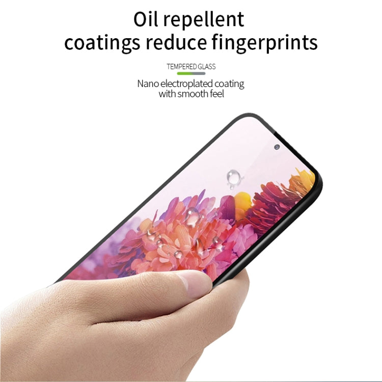 Tempered glass screen protector with oil-repellent coating to reduce fingerprints