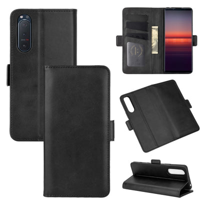 Black leather flip wallet phone case with magnetic closure, card slots, and stand view