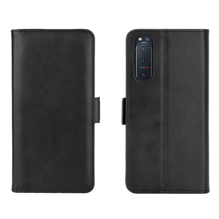 Black leather flip phone case with front cover and camera cutout detail