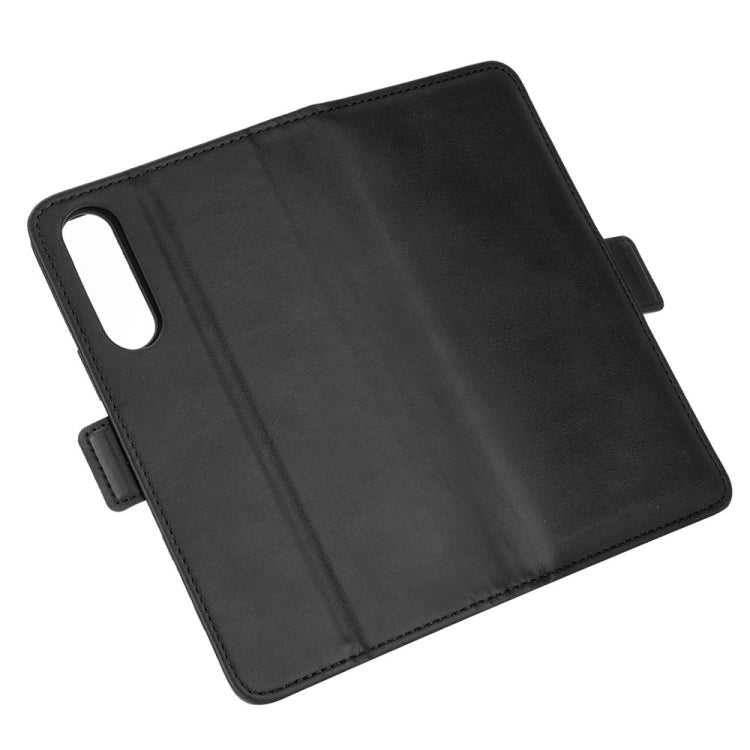 Black leather folio flip case with phone camera cutout and button-side strap