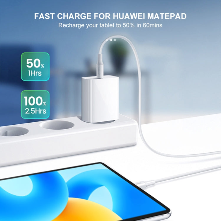 White USB-C charger and cable connected to a tablet on a charging dock