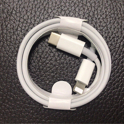 Close-up of white USB-C to 8-pin charging cable connectors