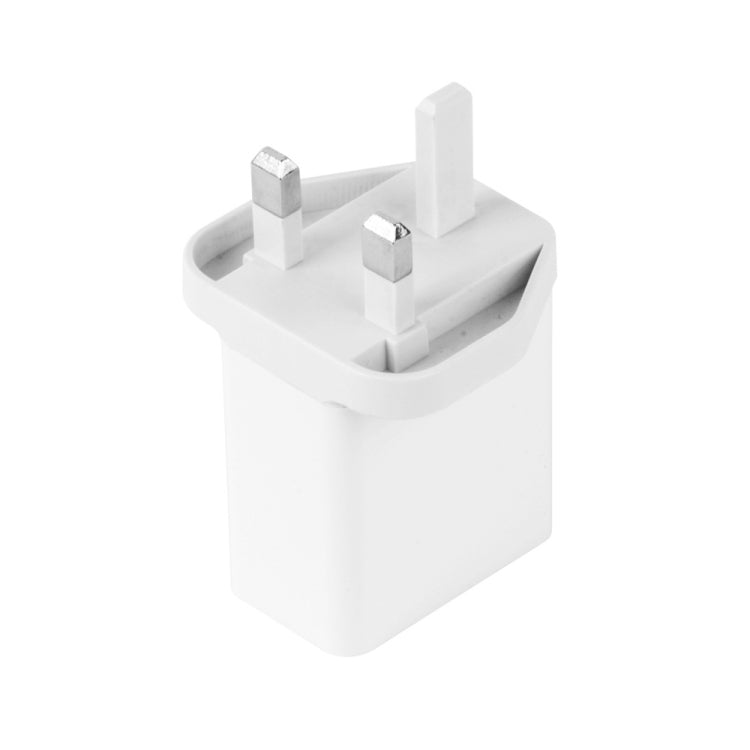 White UK plug wall charger block with two metal prongs and charger ports