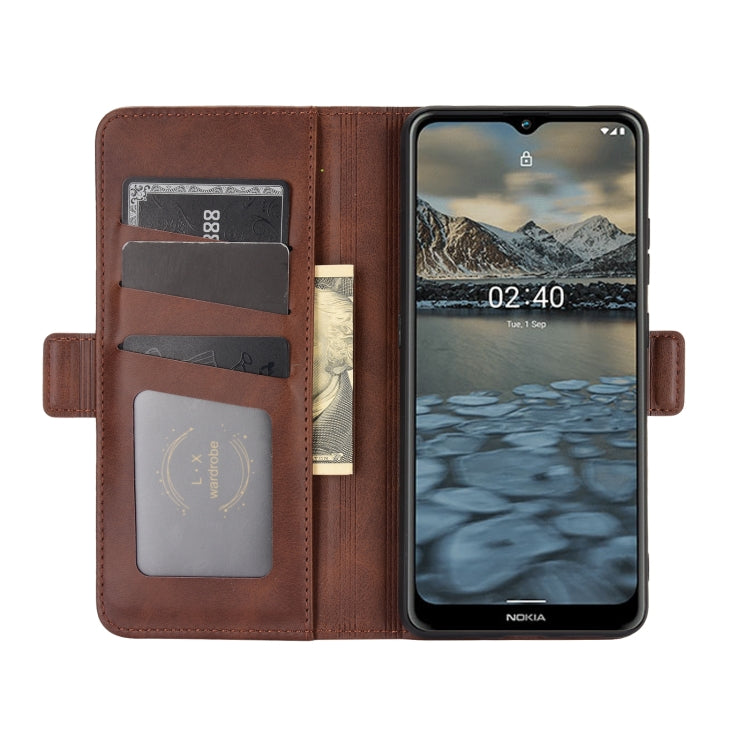 Brown leather flip phone case with card slots and magnetic closure, with phone installed.
