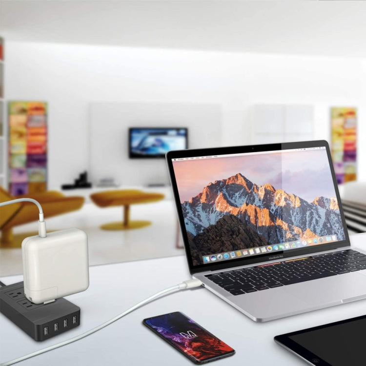 USB-C charger connected to laptop and phone via USB-C cable