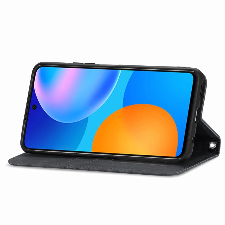 Black folio flip phone case propped up for hands-free viewing