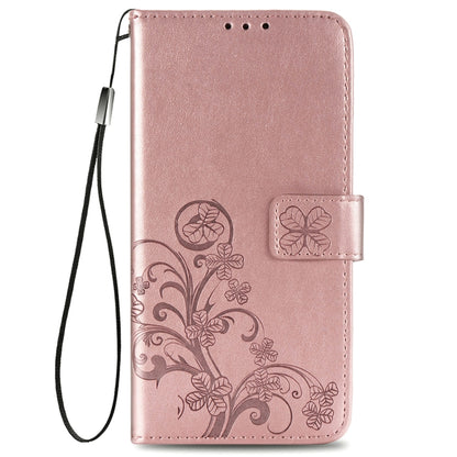 Rose gold leather folio phone case with floral embossing and lanyard strap