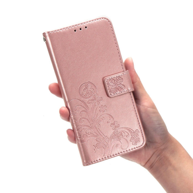 Rose gold leather wallet phone case with embossed floral pattern and clasp buckle