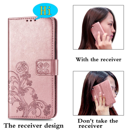 Rose gold leather flip phone case with floral embossing and front clasp