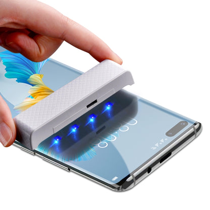 UV liquid screen protector with blue curing lights on Huawei Mate 40 Pro screen