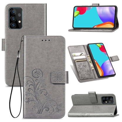Gray leather wallet phone case with floral emboss, lanyard, card slots, and stand