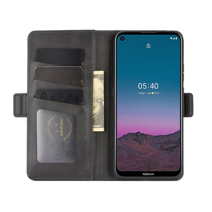 Black leather flip phone case with card slots and magnetic closure, phone mounted