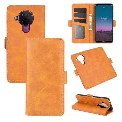 Tan leather flip phone case with magnetic buckle, card slots, and stand
