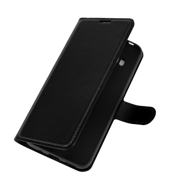 Black litchi-texture slim flip phone case with side cutouts and strap holder
