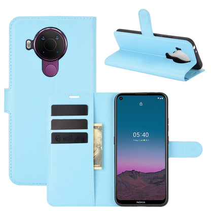 Light blue litchi-texture wallet flip case with card slots for Nokia 5.4, stand view