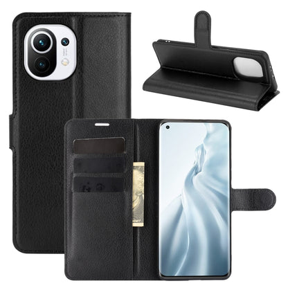 Black flip phone wallet case with card slots, holder strap, and kickstand for Xiaomi Mi 11