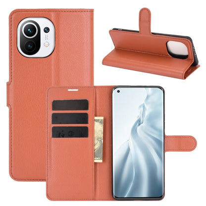 Brown flip phone wallet case with card slots and holder strap for Xiaomi Mi 11