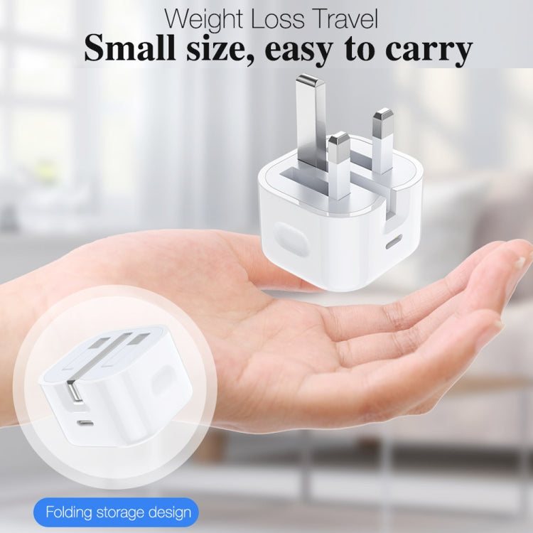 White folding travel charger in a hand, compact and easy to carry