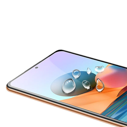 Tempered glass screen protector film on phone display, clear glass with bubbles effect