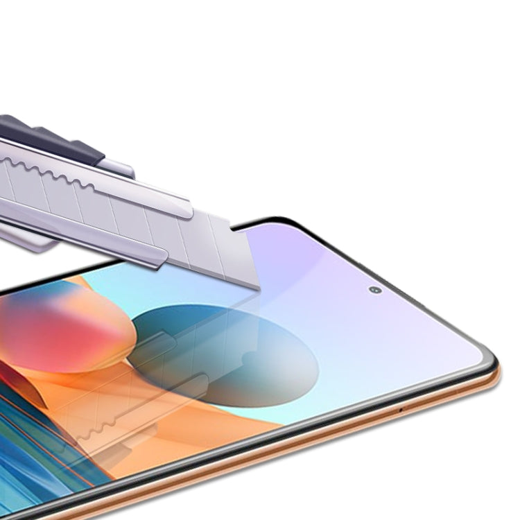 Tempered glass screen protector film being laid across smartphone display