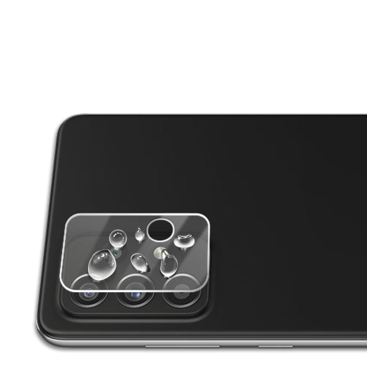Tempered glass lens shield covering multiple rear camera lenses on a phone