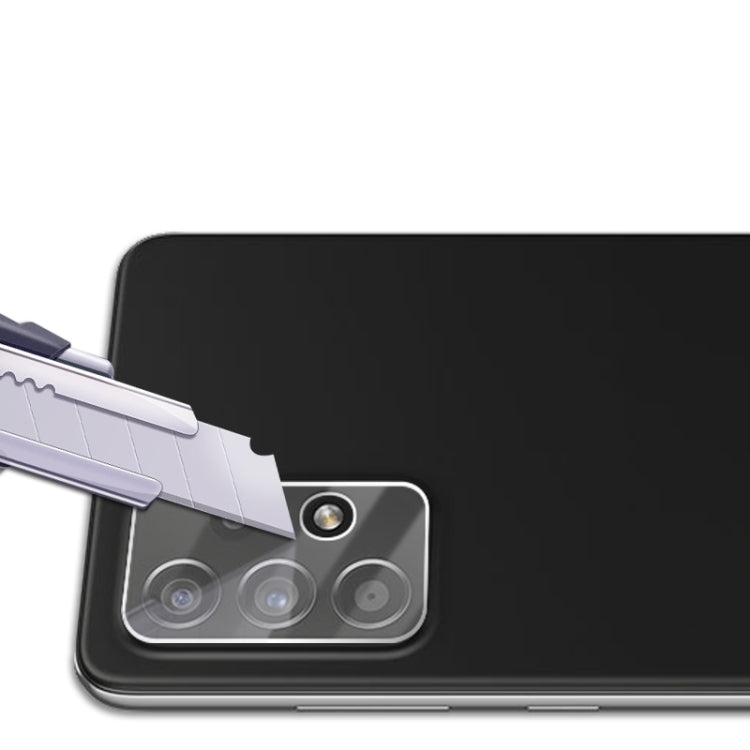 Tempered glass lens shield being applied over a phone’s rear camera lenses