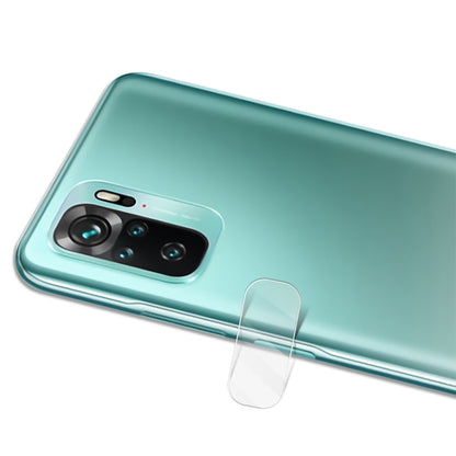 Transparent tempered glass lens protector with rounded edge covering rear camera.